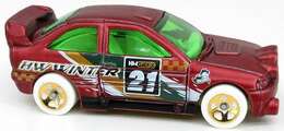 Hot Wheels 2021 - Holiday Hot Rods # 3/5 -  Ford Escort - Satin Dark Red - Gold 5SP Wheels on White Tires - Green Windows - White Interior - Gold Plastic Base